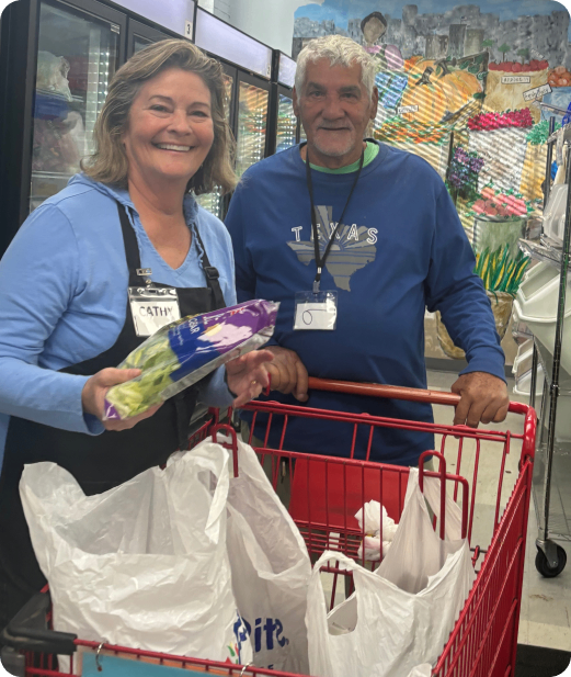 A man and woman are holding groceries in their hands.